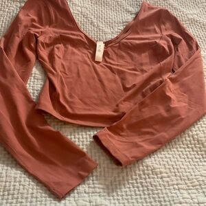 Lululemon Womens top with long sleeves.  New. V neck. Salmon color.